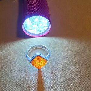 925 sterling silver ring set with a square or diamond-cut amber piece.